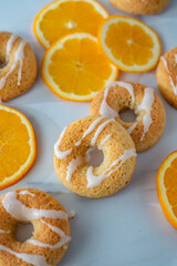 sweet home made orange donuts on a table