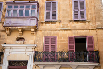Narrow streets with colourful window boxes in Valetta, Malta