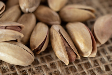 shelled pine nuts on a straw mat. close-up.