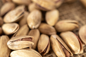 shelled pine nuts on a straw mat. close-up.