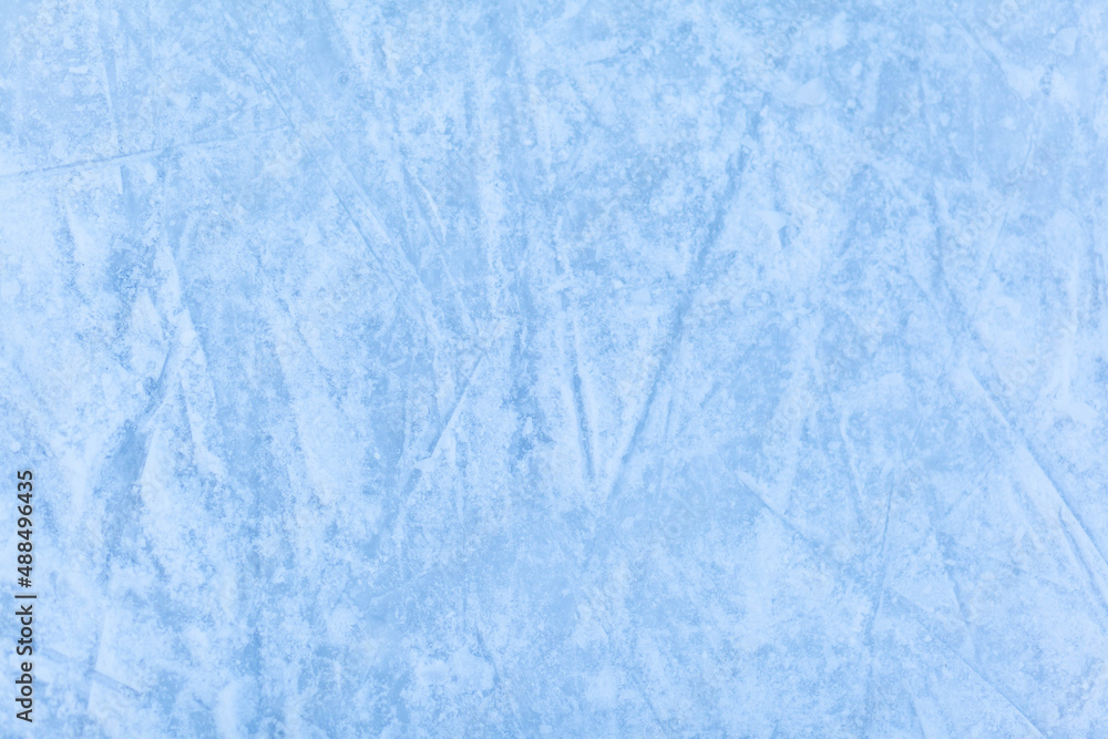 Poster empty ice rink with skate marks after the session outdoor. skating ice rink texture covered with sno