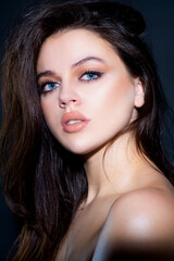 Fototapeta premium Brunette girl. Hair care. Shampoo and hair balm. Haircare concept. Beauty portrait.