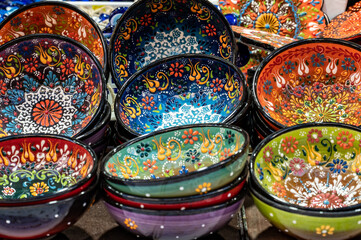 Painted decorative plates and lacquered dishes at the market.