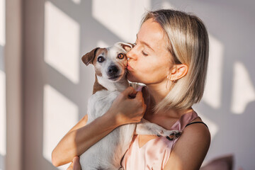 Happy woman with dog at home