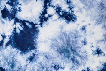 Close-up batik shirt with indigo blue dye on white fabric cotton background on top-view