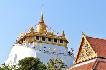 Phu Khao Thong or Golden Mountain is a steep artificial hill inside the Wat Saket compound. A popular Bangkok tourist attraction and has become a symbol of the city.