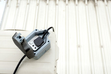 Close-up of red trailer plug 2 sockets with on-off switch for use with hand tools.