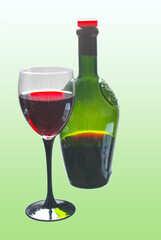 A glass of red wine and a green bottle of wine on a pale green background.