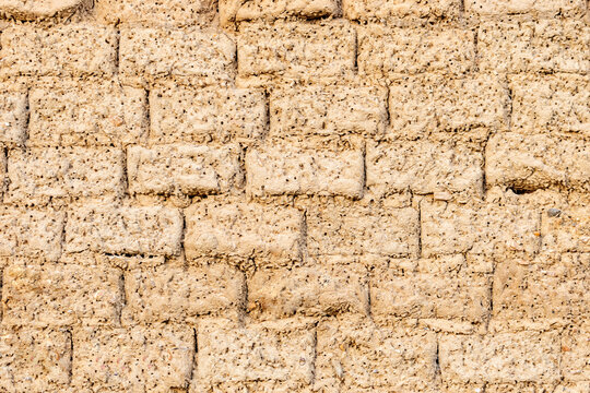 Wall texture of old adobe bricks