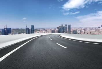 Obraz premium Road and Chinese modern city buildings background