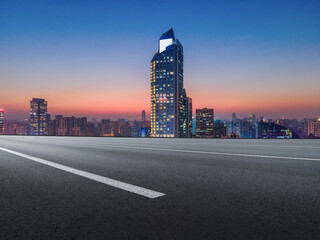 Fototapeta na wymiar Road and Chinese modern city buildings background