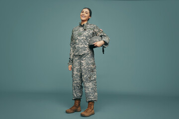 United States servicewoman smiling happily in a studio