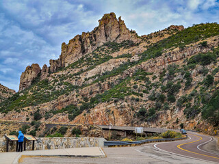 A landscape view of Mount Lemmon under a blue cloudy sky on a sunny day