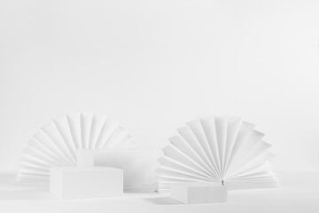White soft light abstract scene with set of three different size  rectangle podiums template for showing cosmetic product or goods with round oriental paper fans, side view, corner, 3d, copy space.