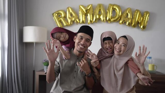 beautiful muslim family portrait together smiling to camera