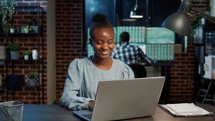 Financial consultant planning trade exchange sales growth on laptop, using real time stock market...