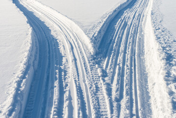 Two snowmobile roads close-up.