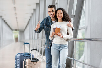 Travel Advertisement. Happy Young Arab Couple Posing At Airport