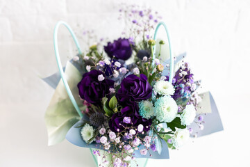 purple bouquet of roses and chrysanthemums. white background