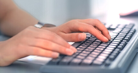 Close-up Of Female Hand Typing On Keyboard.