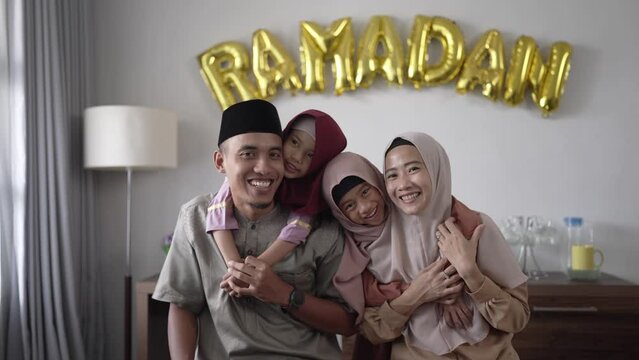 beautiful muslim family portrait together smiling to camera