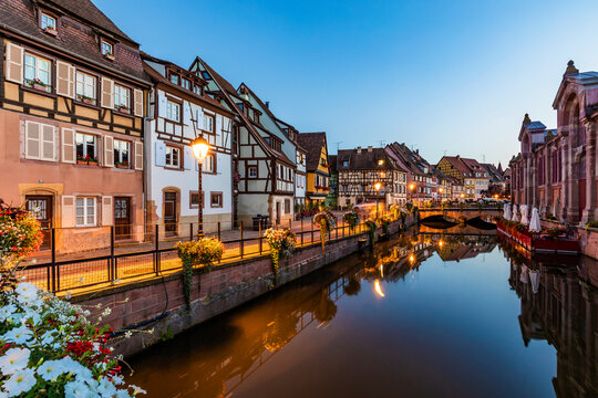 France, Alsace, Colmar, Lauch river canal in Little Venice at dusk