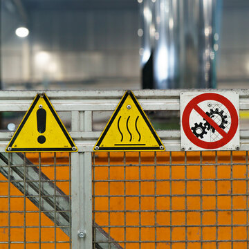 Old industrial safety sign. Warning safety sign inside a factory