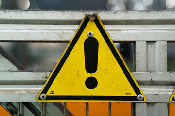 Old industrial safety sign. Warning safety sign inside a factory