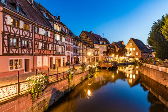 France, Alsace, Colmar, Long exposure of Lauch river canal in Little Venice at dusk