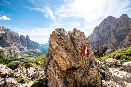Italy, South Tyrol, Hiking trail mark painted on boulder in Sella Group