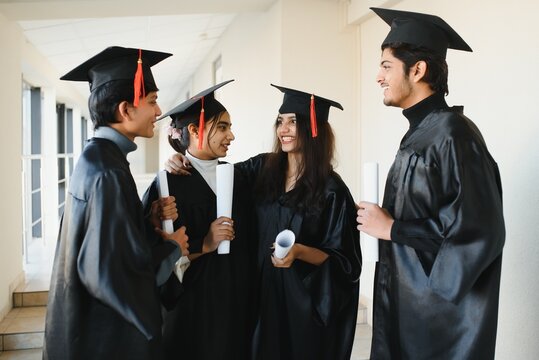 education, graduation and people concept - group of happy indian students - Powered by Adobe