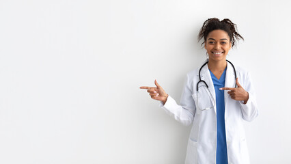Portrait of black doctor smiling and posing to camera