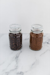 jars of coffee beans next to jar of instant coffee, best tasting option and coffee culture