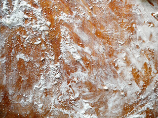 Old wooden board with flour. Background. Desk of white flour, top view