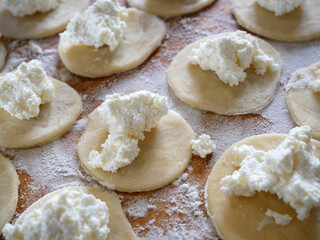 Fresh ravioli handmade cooking on wooden desk. And ricotta ravioli