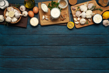 Fototapeta na wymiar Concept of cooking garlic sauce on wooden background