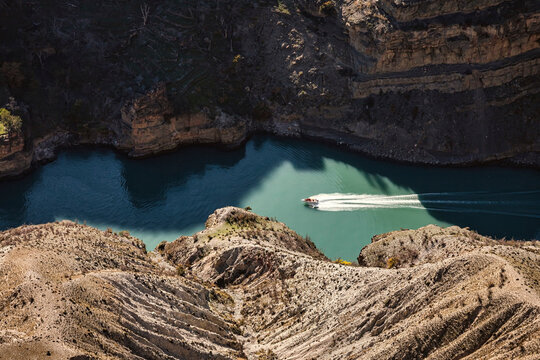 Speed boating in Sulak canyon by rocky mountains in Dagestan, Russia