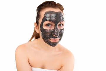 portrait of a woman We are after thanks and cosmetic procedures with a black mask for skin care