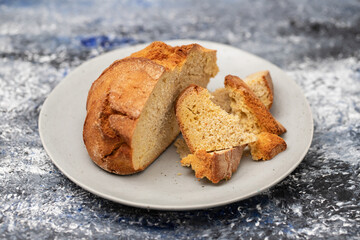 typical portuguese corn bread on gray plate on ceramic