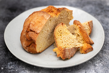 typical portuguese corn bread on gray plate on ceramic