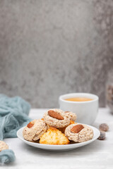 coconut and almond cookies on a small saucer