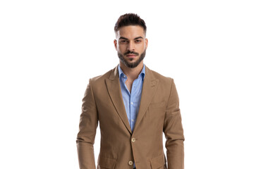 portrait of handsome man in brown suit posing on white background
