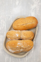 fresh bread in small dish on gray ceramic