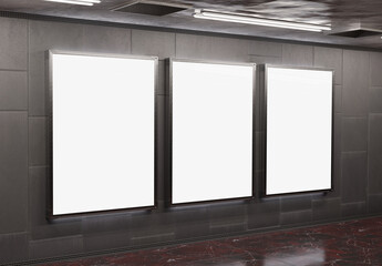 Three blank billboards on underground subway wall Mockup. Hoardings advertising triptych on train station interior 3D rendering