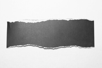 Paper tear, ripped paper edge, torn edge, isolated paper tear white on black, paper corner with space for copy