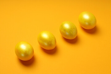 Concept of Easter eggs on orange background