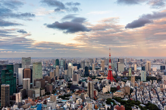 Japan, Kanto Region, Tokyo, Clouds over capital city downtown at dusk