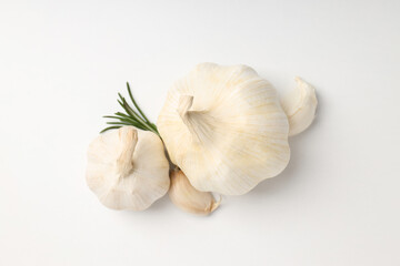 Garlic with rosemary on white background, close up