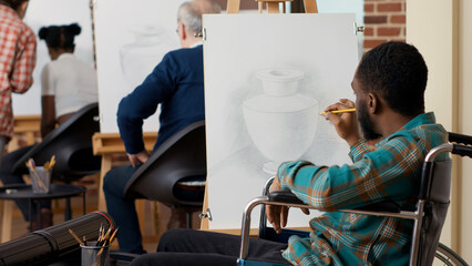 Art class student in wheelchair using pencil on canvas to draw vase model for personal skills growth. Learn drawing practice to create artwork design and sketch in artistic school class.