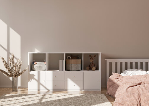 Empty cream wall in modern child room. Mock up interior in scandinavian style. Free, copy space for your picture, poster. Console, bed, vase with pampas grass, toys. Cozy room for kids. 3D rendering.